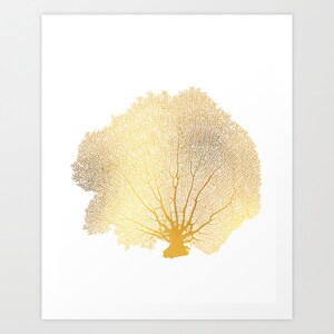 May include: A gold-colored sea fan coral silhouette on a white background.