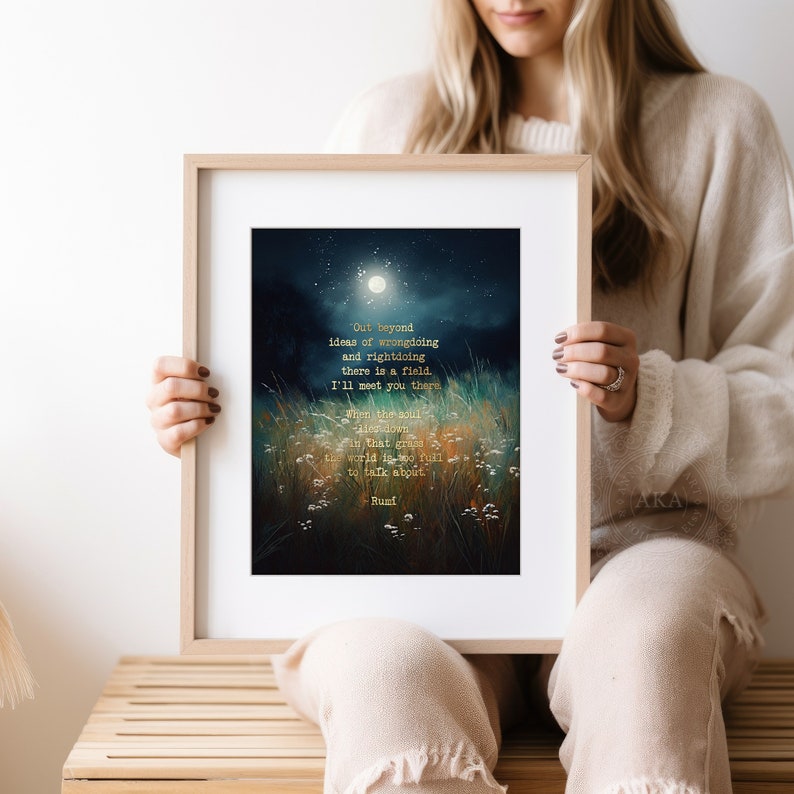 May include: A framed print with a dark blue and green watercolour background featuring a moon and a field of grass. The print includes a poem in gold lettering that reads: "Out beyond ideas of wrongdoing and rightdoing there is a field. I'll meet you there. When the soul finds that grass the world is too full to talk about. -Rumi"