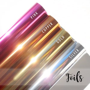 May include: Four rolls of metallic foil in pink, copper, gold, and silver. The rolls are labeled with their respective colors. The text "Foils" is written in a decorative font at the bottom of the image.