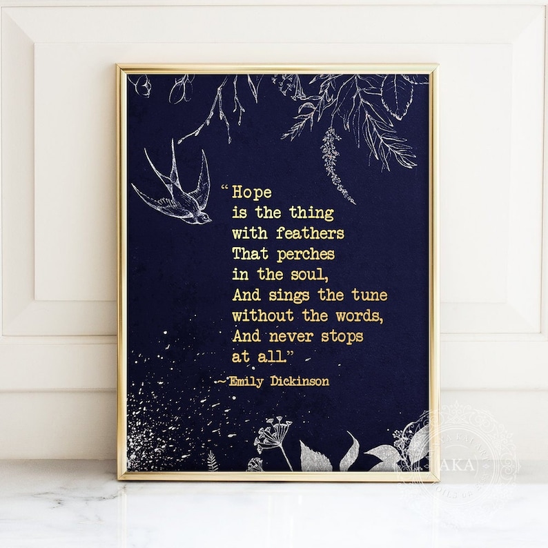 May include: A navy blue printable art print with a gold quote by Emily Dickinson about hope. The quote reads "Hope is the thing with feathers That perches in the soul, And sings the tune without the words, And never stops at all."