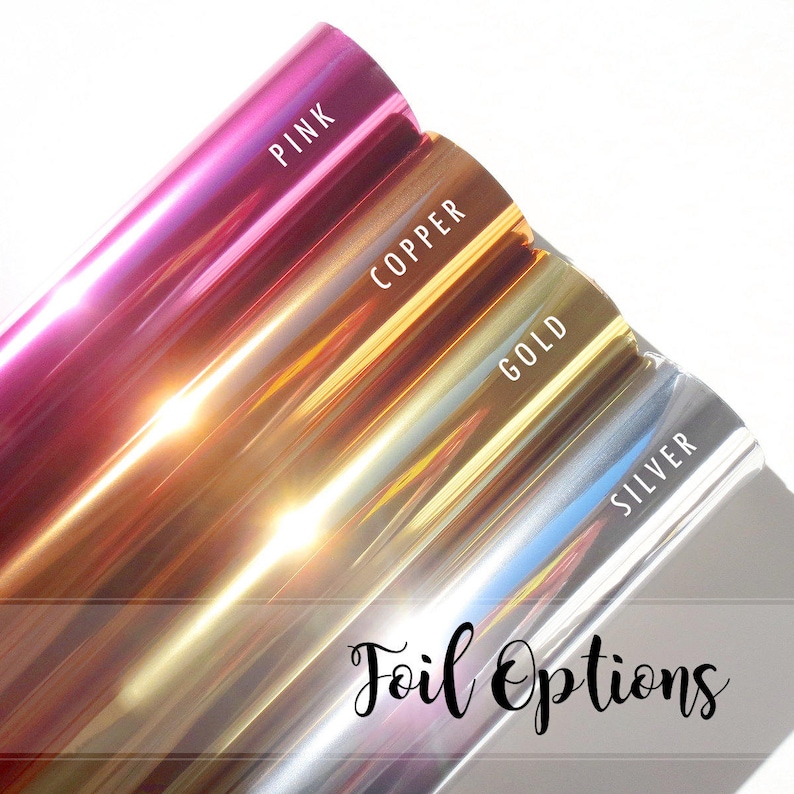 May include: Four rolls of metallic foil in pink, copper, gold, and silver. The foil is shiny and reflective. The text "Foil Options" is written in black cursive at the bottom of the image.