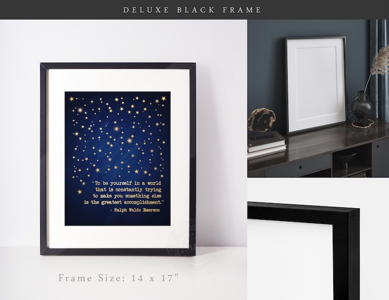 May include: A black framed print with a blue background and gold stars. The print features a quote by Ralph Waldo Emerson: "To be yourself in a world that is constantly trying to make you something else is the greatest accomplishment." The frame is 14 inches by 17 inches.