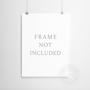 May include: A white poster with the text "FRAME NOT INCLUDED" printed in gray. The poster is hanging on a white wall with two silver clips.