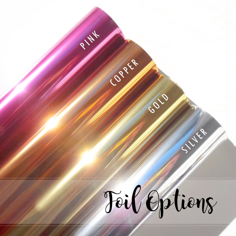 May include: Four rolls of metallic foil in pink, copper, gold, and silver. The rolls are labeled with their respective colors. The text "Foil Options" is written in cursive below the rolls.