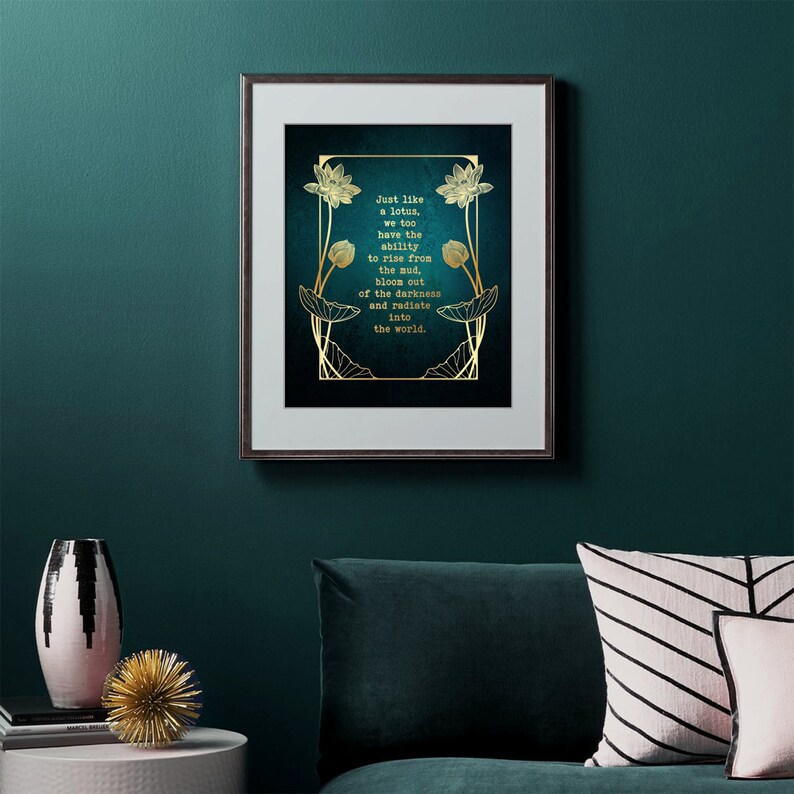 May include: Framed art print with a teal background and gold lotus flower design. The text reads: "Just like a lotus, we too have the ability to rise from the mud, bloom out of the darkness and radiate into the world."