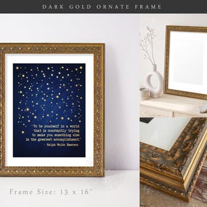 May include: A gold ornate frame with a blue background and gold stars. The frame contains a quote by Ralph Waldo Emerson: "To be yourself in a world that is constantly trying to make you something else is the greatest accomplishment." The frame is 13 inches by 16 inches.