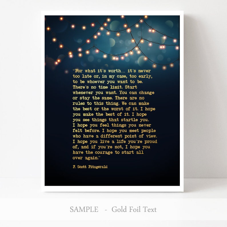 May include: A dark blue printable art print with a quote by F. Scott Fitzgerald about life and time. The quote is written in gold foil text and is surrounded by a string of white lights against a dark blue background.