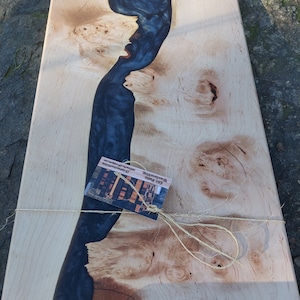 Maple burl and black epoxy charcuterie board with matte black handles