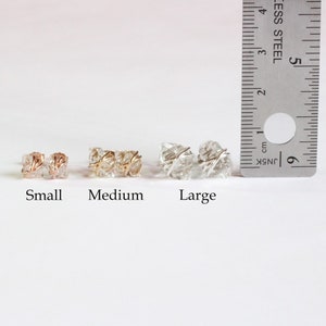 The small, medium, and large Herkimer Diamond Stud Earrings are compared next to a standard ruler. Small is 7-8mm, medium is 8-10mm, and large is 10-12mm.