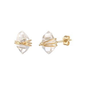 Herkimer Diamond Stud Earrings in gold wire and matching gold push back closures. The quartz crystals are wrapped three times in gold wire for completed post earrings. The quartz crystals are transparent, colorless, and naturally faceted.