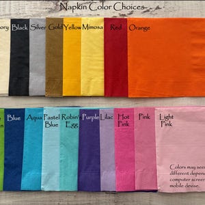 May include: A color chart of napkin colors. The colors are arranged in two rows. The top row includes white, ivory, black, silver, gold, yellow, mimosa, red, and orange. The bottom row includes green, lime green, blue, aqua, pastel blue, robin's egg, purple, lilac, hot pink, and light pink. The text "Napkin Color Choices" is at the top of the chart. The text "Colors may seem slightly different depending on computer screen, tablet or mobile device." is at the bottom of the chart.