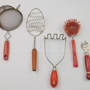 Vintage Red Handled Kitchen Utensil: Rustic Farmhouse Gadget