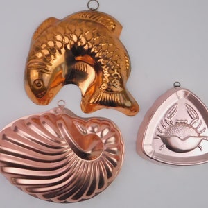 Choice copper molds, candy, gelatin, chocolate, country farmhouse kitchen wall hanging. Vintage shell, crab, fish, grapes, hanger, rose gold