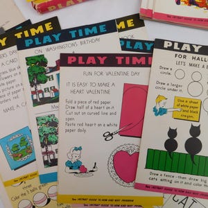 May include: A collection of vintage Play Time activity sheets featuring instructional text and illustrations for holiday-themed crafts. The pages include guides for making a Valentine heart, drawing a black cat for Halloween, and various seasonal projects with colorful graphics and black text.