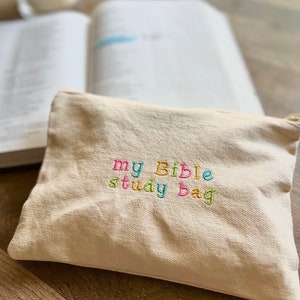 May include: A white canvas bag with the words "my Bible study bag" embroidered in colorful thread.