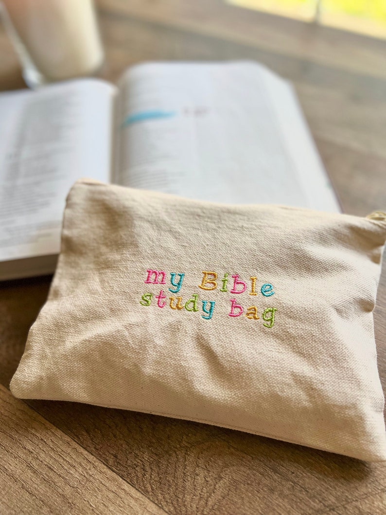 May include: A white canvas bag with the words "my Bible study bag" embroidered in colorful thread.