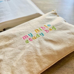 May include: A beige canvas bag with the text "my Bible study bag" embroidered in colorful thread.