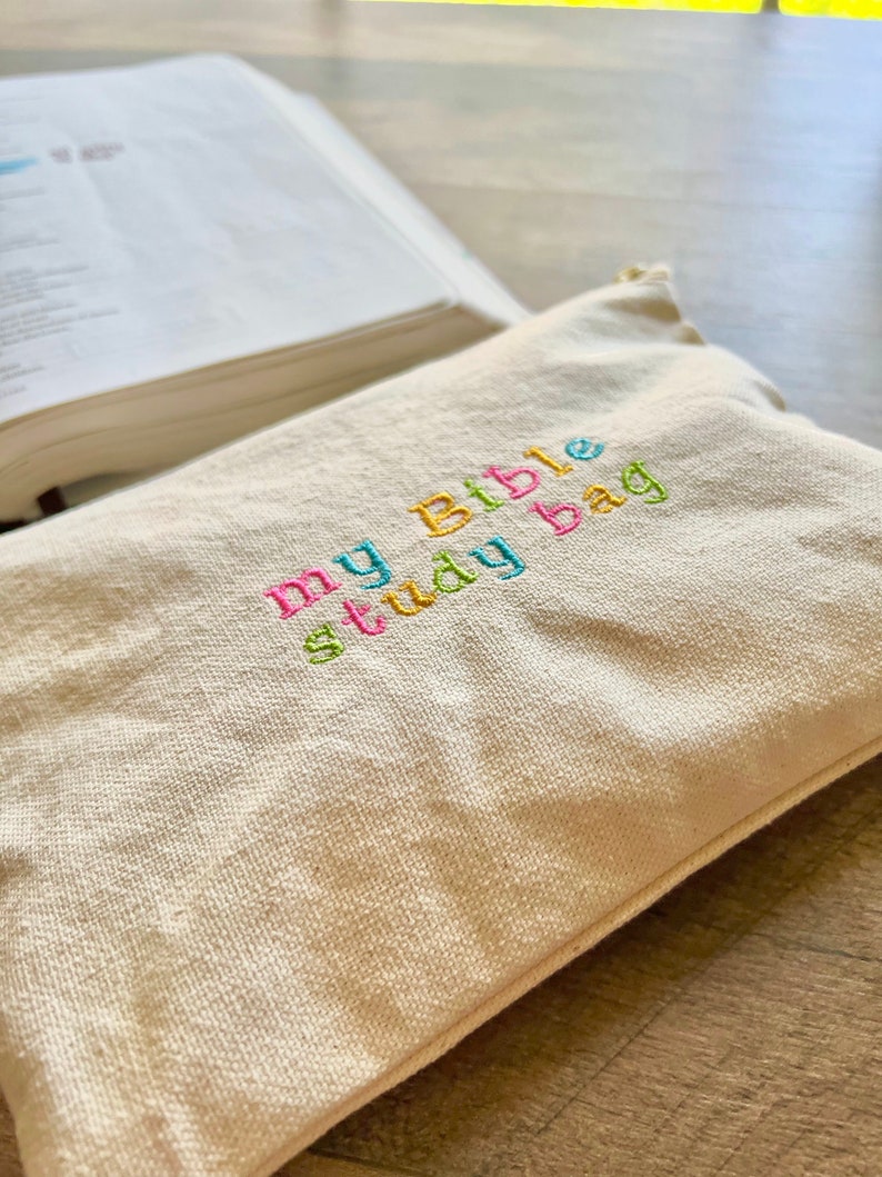 May include: A beige canvas bag with the text "my Bible study bag" embroidered in colorful thread.