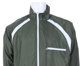 May include: A green windbreaker jacket with white accents and a white zipper. The jacket has a white Nike logo on the bottom right side.