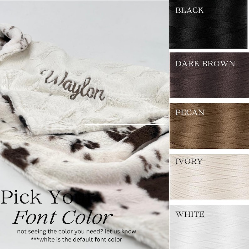 May include: A plush, cow-print blanket with the name "Waylon" embroidered in a script font. The image includes a color chart with thread options: black, dark brown, pecan, ivory, and white. Text reads "Pick Your Font Color".