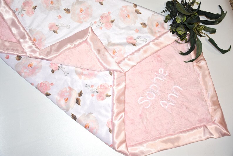 Celebrate the arrival of a baby girl with this pink minky baby blanket, offering unparalleled comfort and style.
