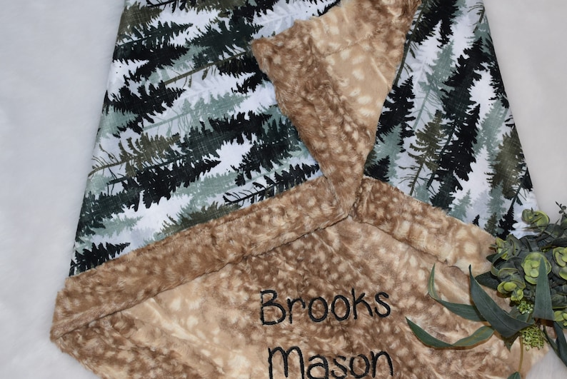 Create a cozy haven for your baby boy with a hunter green minky blanket. The fawn baby blanket brings a touch of the forest to her nursery, complete with a personalized twist.