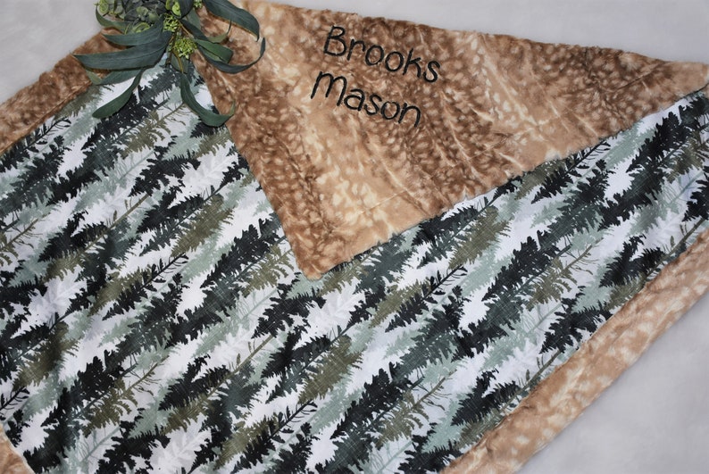 Envelop your bundle of joy in the warmth of a boy minky blanket, featuring a charming fawn design. This forest green baby gift adds a touch of woodland enchantment to your nursery