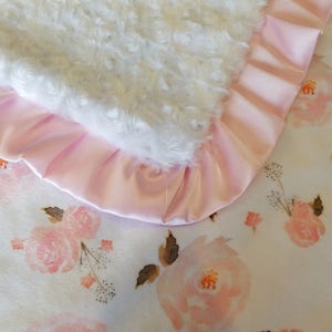 Make a statement with this soft and charming boho baby girl blanket, a delightful gift to adorn a newborn's nursery.