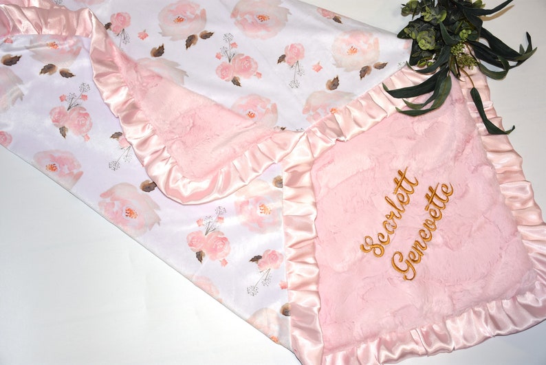 Give the gift of personalized luxury with this custom floral blanket, offering comfort and beauty for baby girls.