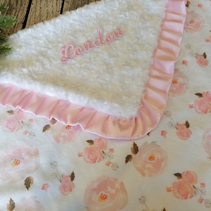 Shower a baby girl with love and warmth through this soft and cozy pink minky blanket, an ideal gift for baby showers.