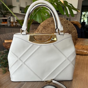 Bolso de mano Calvin Klein de segunda mano con doble asa en la parte superior, color blanco crema, con correa cruzada, moderno bolso de lujo o cartera con forro monogramado
