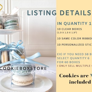 May include: A set of 10 clear favor boxes, each measuring 1.9 inches by 1.9 inches by 1.9 inches. The boxes are decorated with blue ribbons and personalized stickers. The text "COOKIEBOXSTORE party favor box" is visible in the image. Cookies are not included.