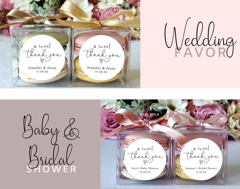 May include: Two clear boxes with macarons and a round sticker that says "a sweet thank you" with a heart. The boxes are tied with a gold ribbon and the text "Wedding Favor" is written in cursive above the boxes.