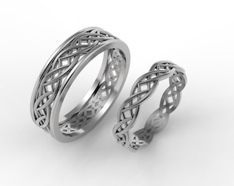 May include: Two silver wedding bands with a Celtic knot design. The bands are intertwined and have a polished finish.