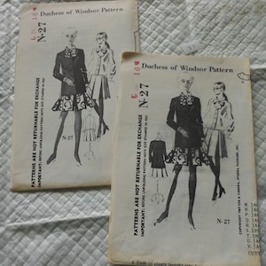 May include: Two vintage sewing patterns for a Duchess of Windsor dress. The patterns are black and white and feature illustrations of women wearing the dress. The pattern number is N-27. The text on the patterns reads "Patterns are not returnable for exchange. Important: Before unfolding pattern note size stamped in red."