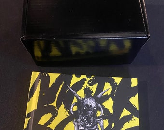 Mork Borg Mystery Box with minis, dice set, enamel pin, and a miserable mystery