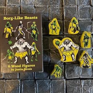 May include: A set of 6 green and yellow painted wooden figures depicting Borg-like beasts. The figures are on a black background with the text "Borg-Like Beasts 6 Wood Figures by Justin Sirois".