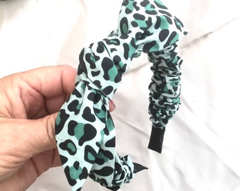 Leopard Print Headband In Shades Of Green With A Touch Of Black.