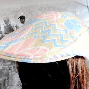 Pastel Print Flat Cap With An Adjustable Baseball Back For A Perfect Fit