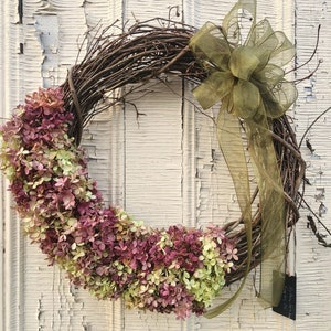 Listing#2
Dried Hydrangeas on grapevine wreath with olive green bow.