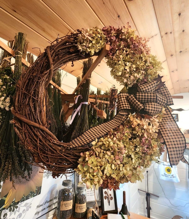 Listing #3
Dried Hydrangeas on a grapevine wreath with primitive plaid bow and rustic stars.