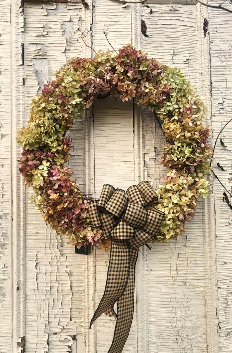 Listing #6
Dried Hydrangeas fully covering grapevine wreath with primitive plaid bow.