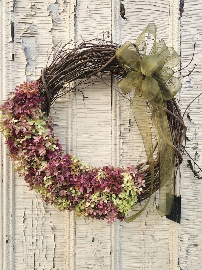 Listing#2
Dried Hydrangeas on grapevine wreath with olive green bow.