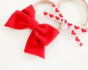 Heart duo/ Valentine’s Day bows/ baby bows/ headbands/ cute baby bows/ red baby bows/ alligator clip bows/ baby headbands