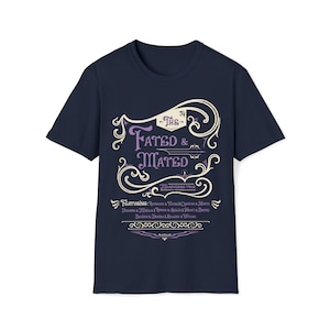 A navy shirt that says The Fated and Mated Maasverse Tour.This is accompanied with white swirls and whirls, and other embellishments. Then it has a featuring section underneath with names from SJM books.