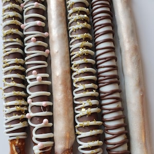 Gourmet Milk and White Chocolate Covered Pretzel Rods! Rosegold and Blush Pink Perfect bridal wedding or baby shower party favor!