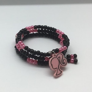 Girl’s Pink and Black Beaded Bracelet on Coil Memory Wire; Kids Bracelet, Featuring an Adorable “Barbie” Charm
