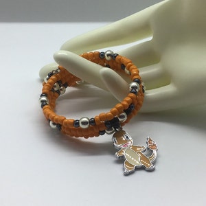 Kids Beaded Memory Wire Coil Bracelet with Orange and Black Seed Beads and  Silver Accents Featuring a Silver “Charmander” Hanging Charm