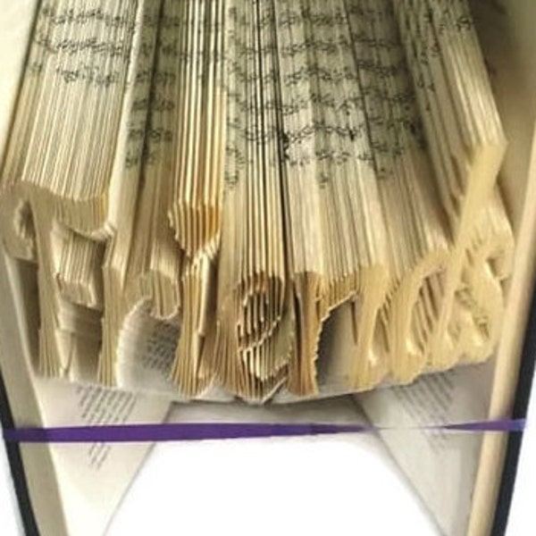 Friends book folding pattern with heart on i. DIY friend gift for a special friend. Create your own book sculpture. Free tutorial