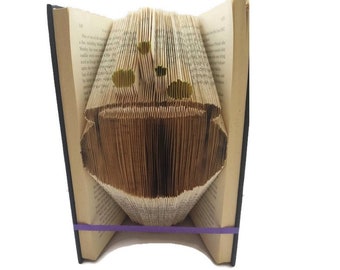 Kessel Buch Faltmuster. Brockender Kessel für Halloween.  Erstellen Sie eine Halloween-Buchskulptur mit kostenloser Anleitung